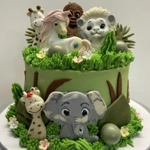 Handmade butter cake decorated with a vibrant jungle theme in vivid colours, featuring playful safari details perfect for a kid’s birthday celebration. Soft, delicious cake with a fun wild adventure design that makes any party extra special!